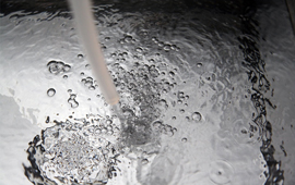purified water pouring out of a tube
